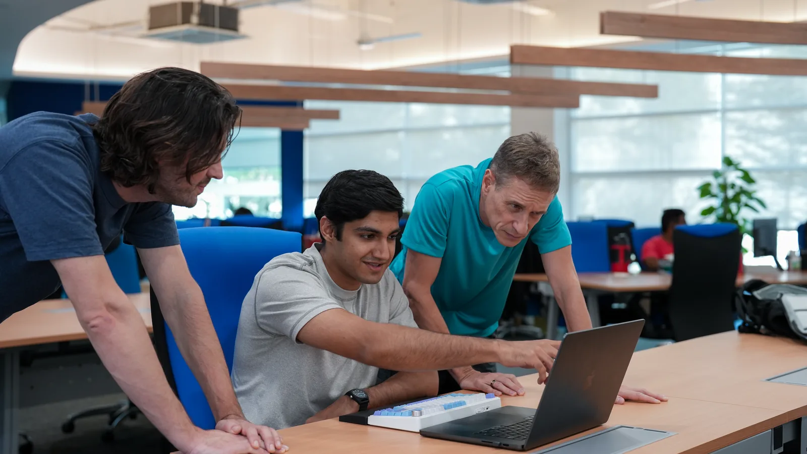 n1 colleagues reviewing work together at a laptop